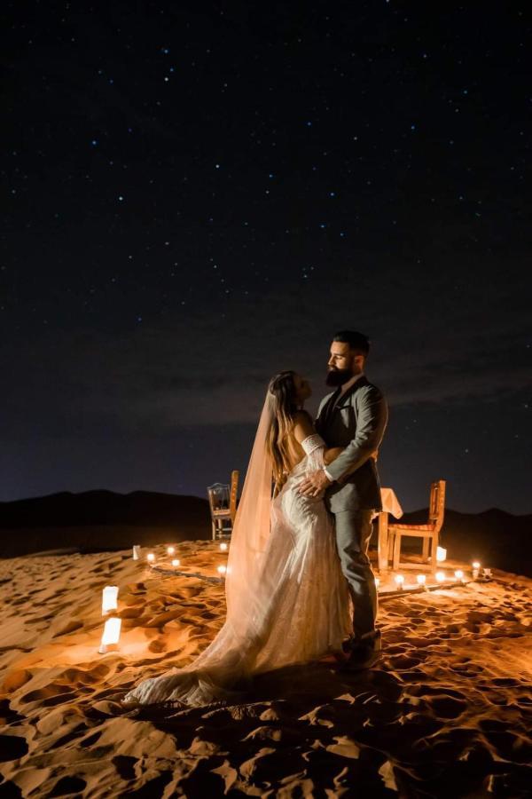 Sahara Majestic Luxury Camp Hotel Merzouga Exterior foto A couple in the desert