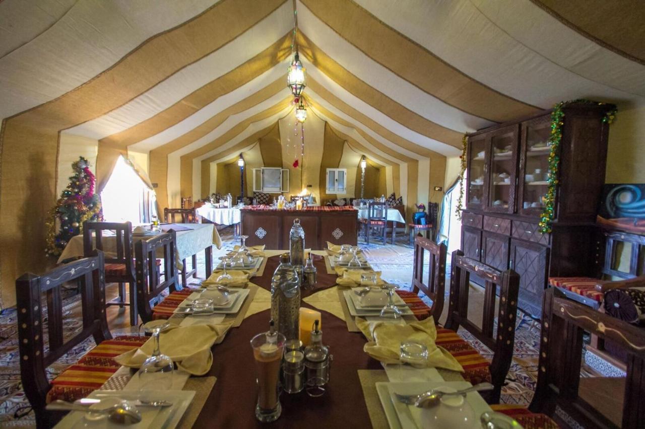 Sahara Majestic Luxury Camp Hotel Merzouga Exterior foto The interior of a tent at the resort