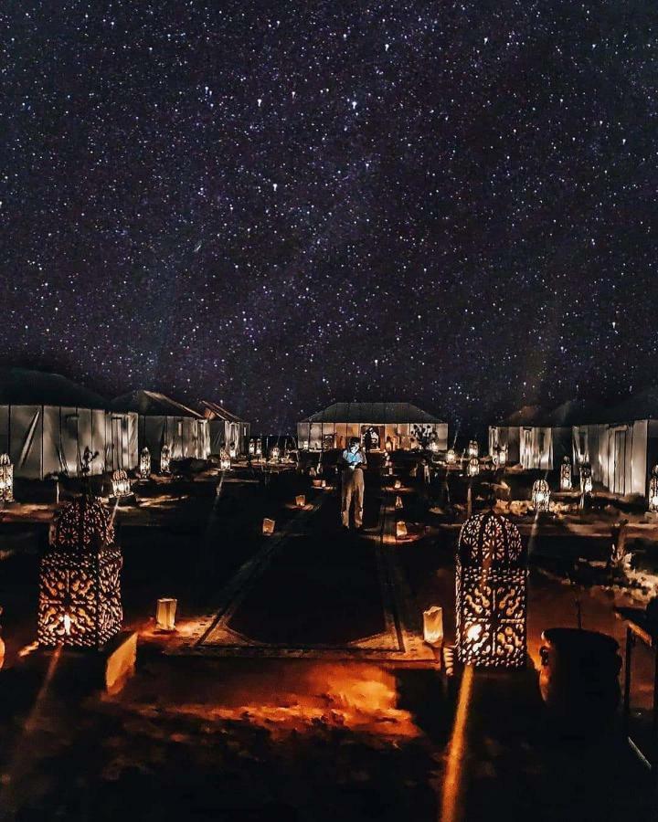 Sahara Majestic Luxury Camp Hotel Merzouga Exterior foto The camp at night